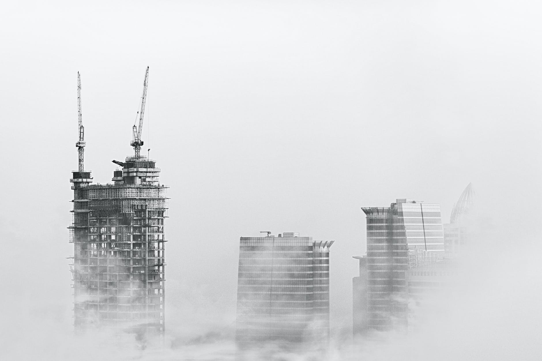 photo of skyscrapers surrounded with clouds