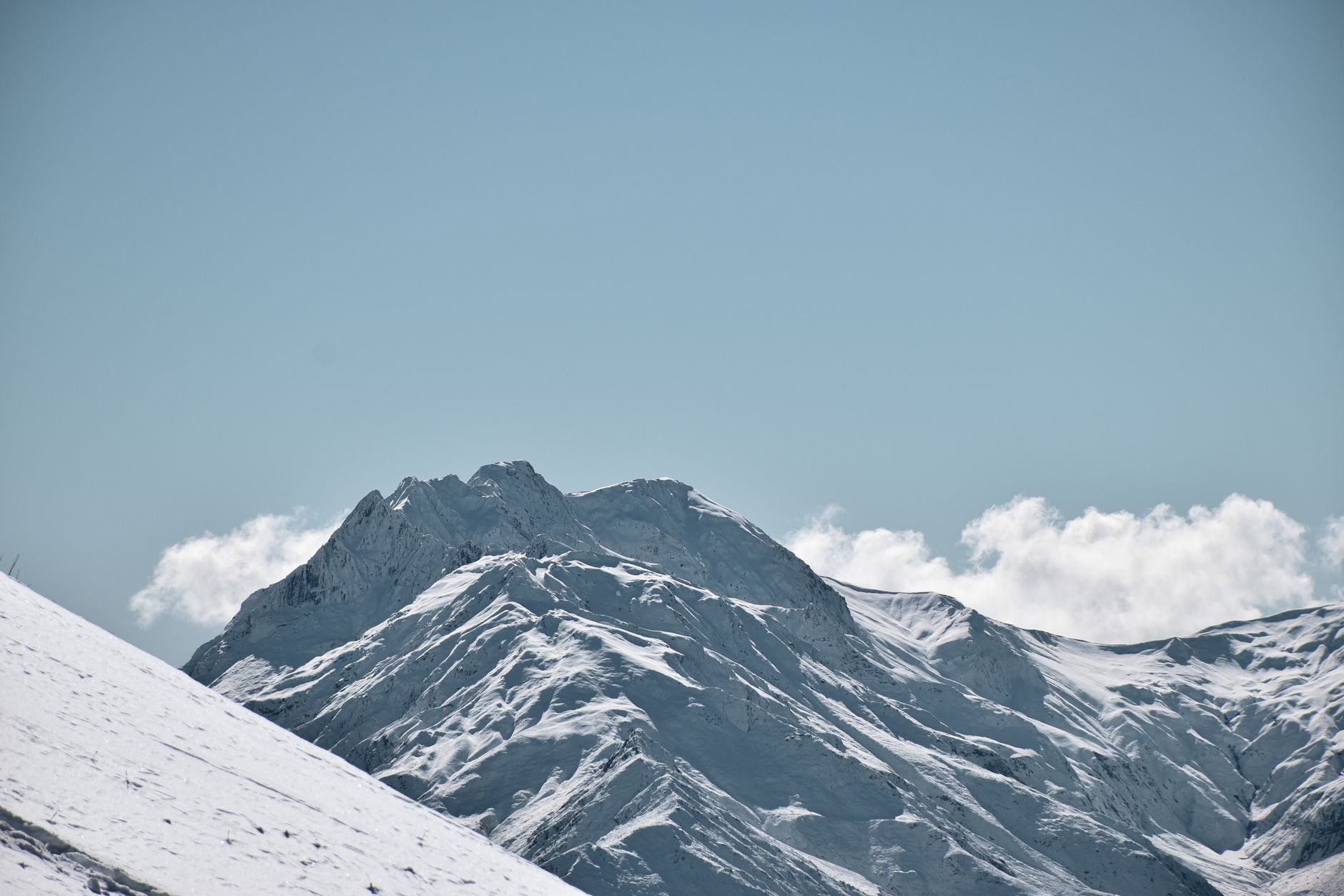 snow covered mountains under the sky
